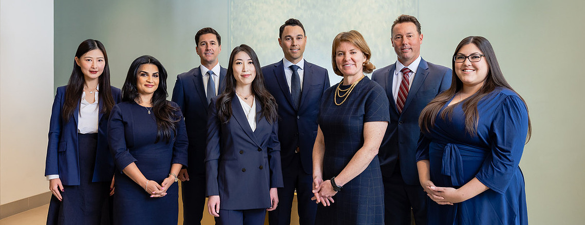 Formal 8-person team/group shot of wealth managers at a First Republic Bank in Palo Alto, California.