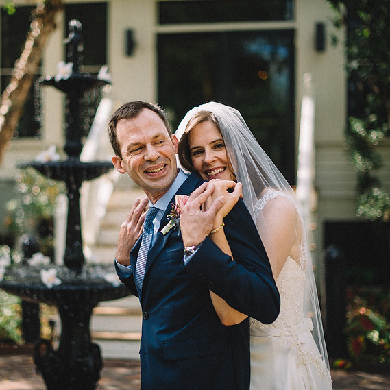newlywed bride and groom embrace