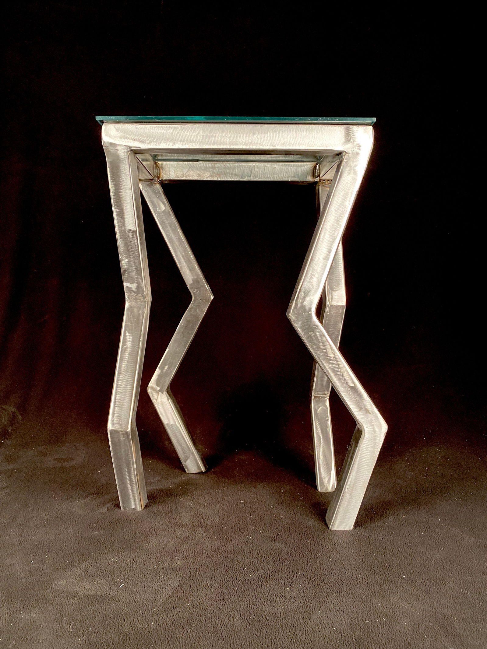 This was a personal exploration when I first started learning how to weld. I needed to challenge my new skill and decided to build a side table for my apartment. I learned a lot through this process and while there is room for improvement, I love it.