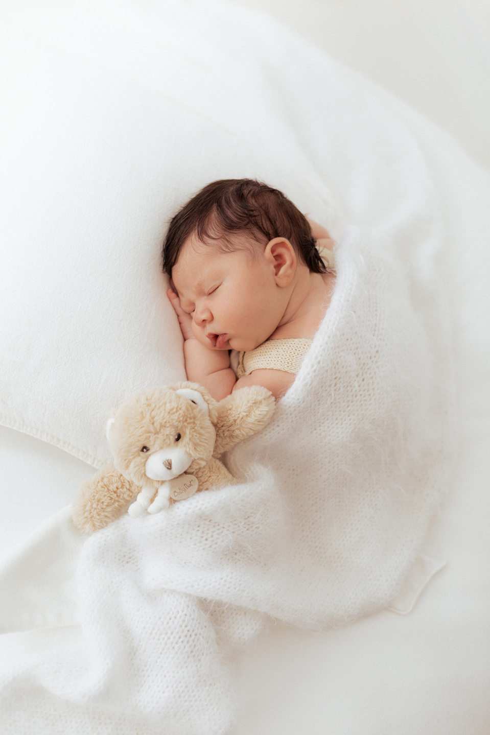 Newborn baby photography with baby bear prop