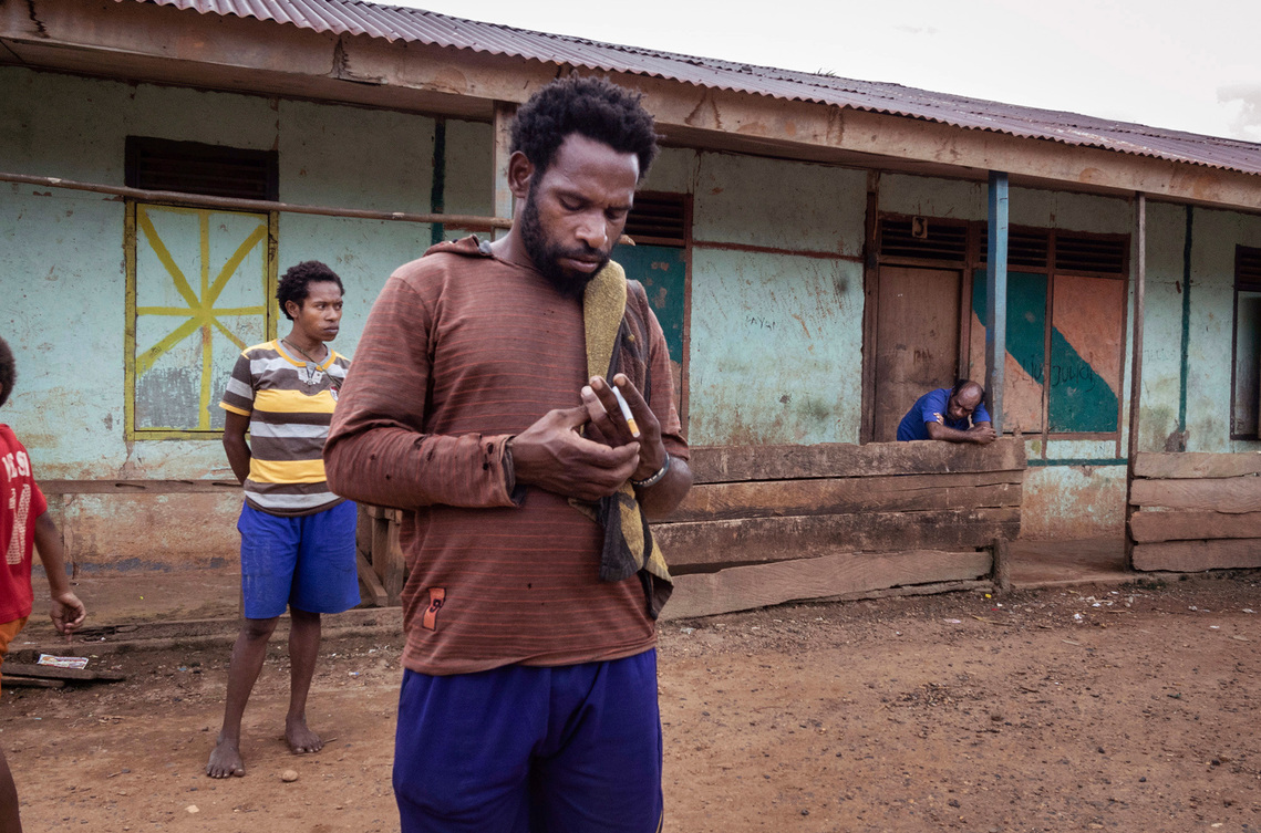 Boven Digul, Papua, Indonesia, 2019. People from the Auyu tribe who work in  oil palm plantations live in a barracks built by the company.