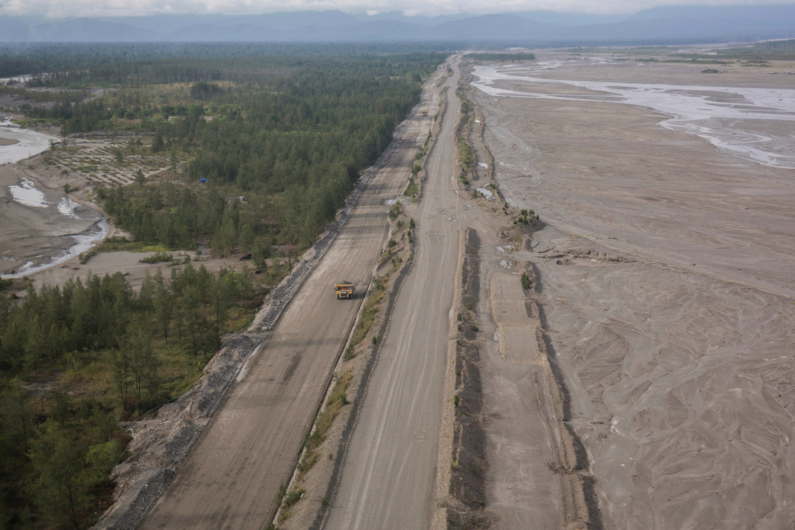Mimika, Papua, Indonesia. 2021. Dam on the westside of the tailing disposal stream ini Otomona river. The dam is about nine meters high. Beside being used to limit the ross-sectional of tailing stream, this dam is also used as the company’s operational ro