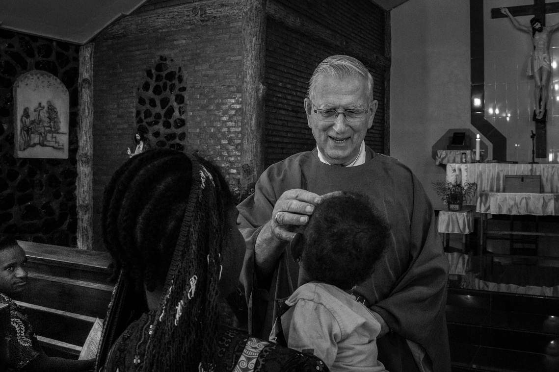 Baptism for the young. Father Lieshout once headed the Teachers Training School (SPG) in Jayapura. Entering retirement in 2007, he returned to Baliem Valley. While executing his pastoral duties, he wrote books.