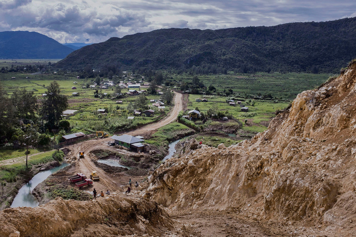 Paniai, Papua, Indonesia, 2015. Trans Papua access road project made by the government to open isolated access. The productive man go to nearby cities although only a few of them go to school and work, mostly unemployed and involved in criminal acts.
