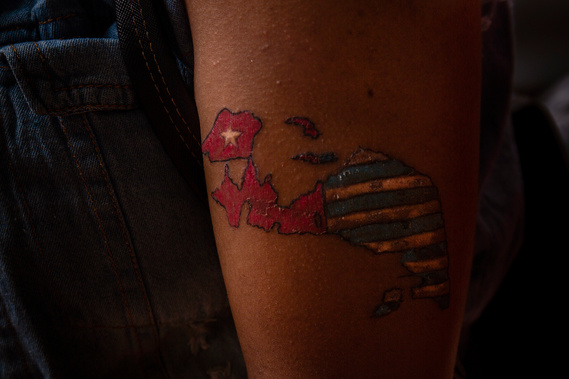 Tattoo an left arm of Abigail Loho, student from Yalimo, Papua. The tattoo are identical to the Bintang Kejora flag's representing the Papuan's cultures, values and beliefs, as well as a symbol of independence.
