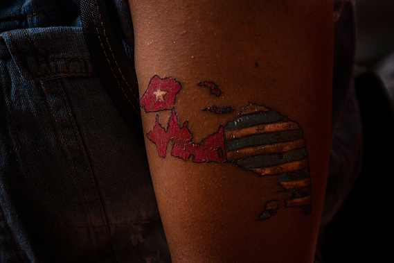 Tattoo an left arm of Abigail Loho, student from Yalimo, Papua. The tattoo are identical to the Bintang Kejora flag's representing the Papuan's cultures, values and beliefs, as well as a symbol of independence.