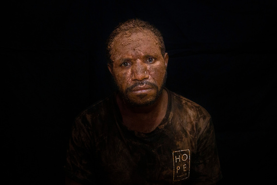Yore Gwijangge smears his face with the mud as an act of grief for Papuans. A military operation in Nduga after the Trans Papua workers shooting incident in early December 2018, caused the Papuans flee to jungle. 263 civilians have died since the incident