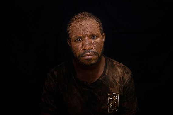 Yore Gwijangge smears his face with the mud as an act of grief for Papuans. A military operation in Nduga after the Trans Papua workers shooting incident in early December 2018, caused the Papuans flee to jungle. 263 civilians have died since the incident