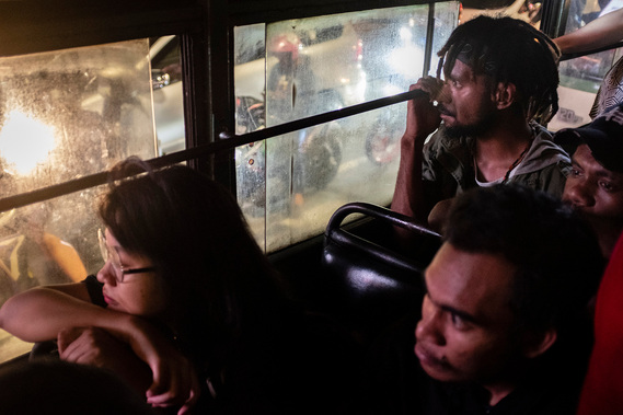 Siwa Hesegem, student from Jayawijaya, on his way to the dormitory in bus. Dormitories for student from Papua in Jakarta are often watched and inspected by security apparatus and intelligence officers, especially when discussions about Papua issues.