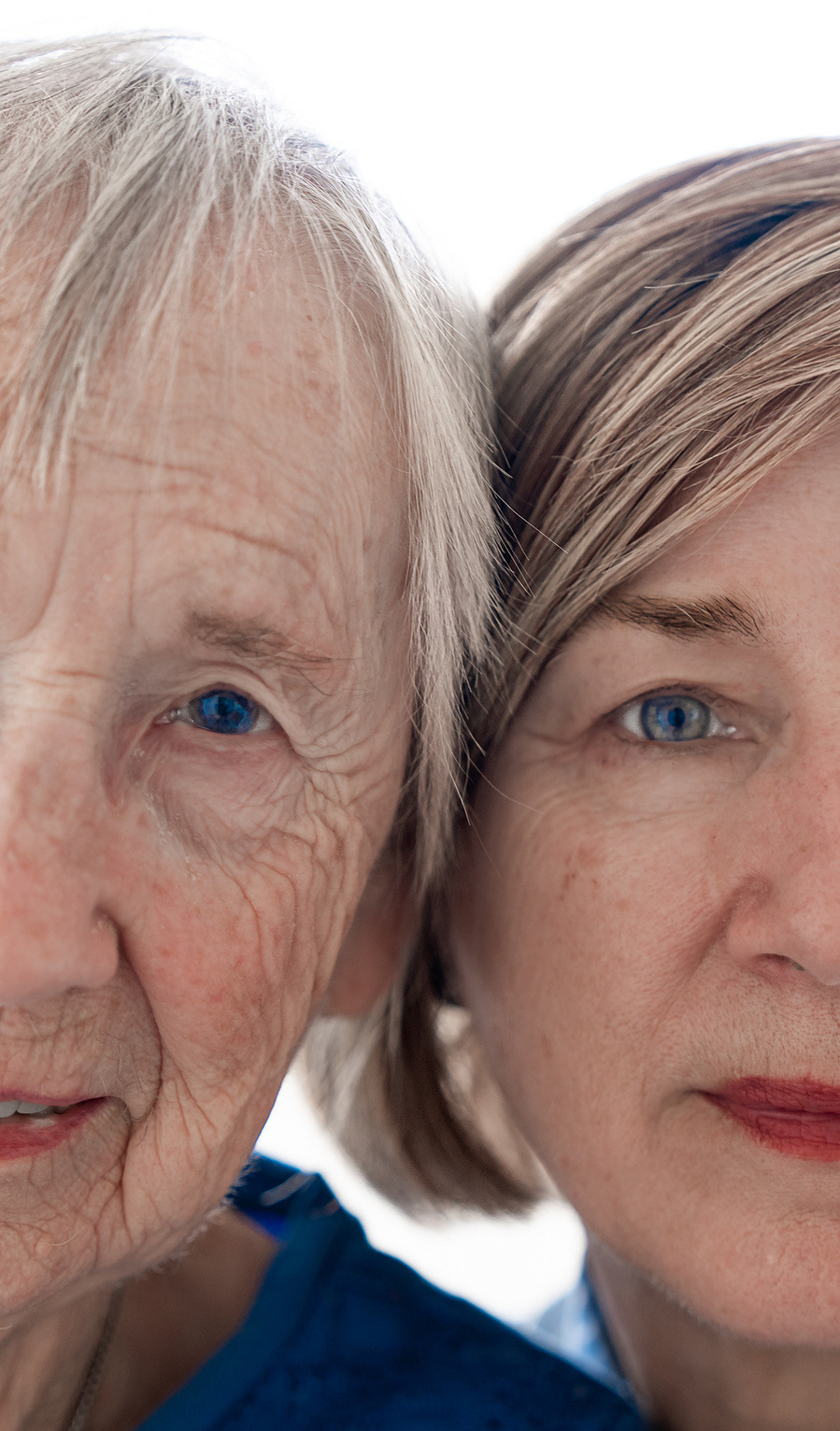 A dramatic close-up portrait of a mother and daughter, capturing generational beauty and a deep, visual connection in family photography.