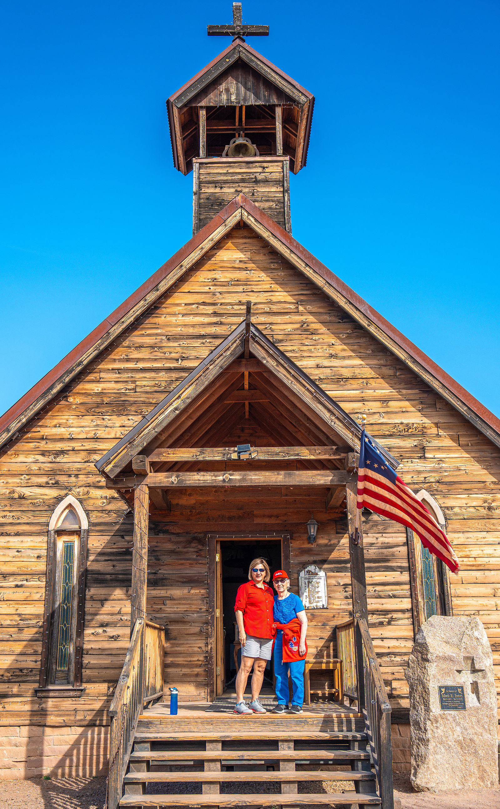 Family group standing in front of the weathered museum at Goldfield Ghost Town, capturing Arizona Old West charm.