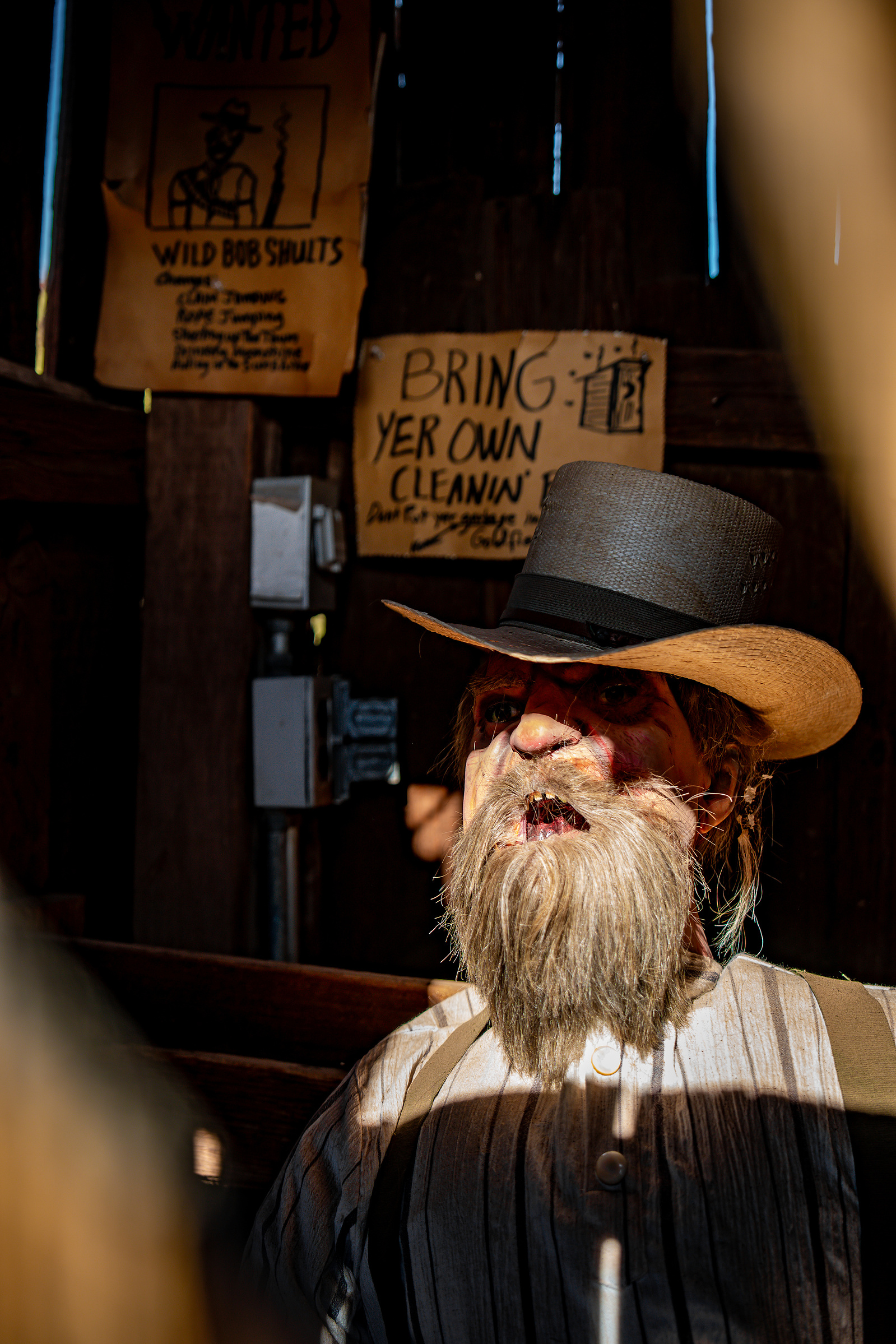 Portrait of an Old West reenactor inside a saloon at Goldfield Ghost Town in Arizona.