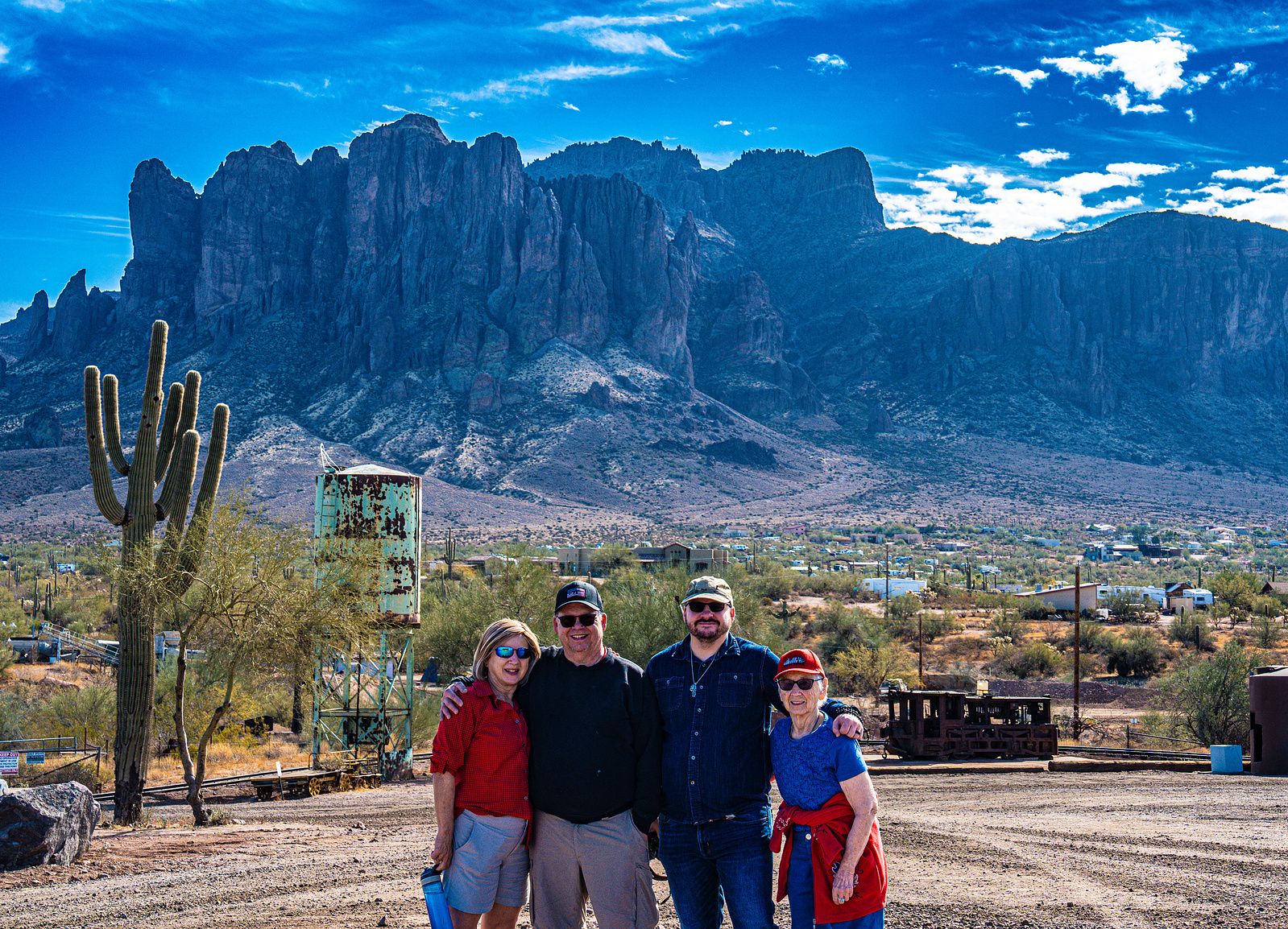 Portrait session with Arizona desert landscape and Superstition Mountains in Goldfield Ghost Town.