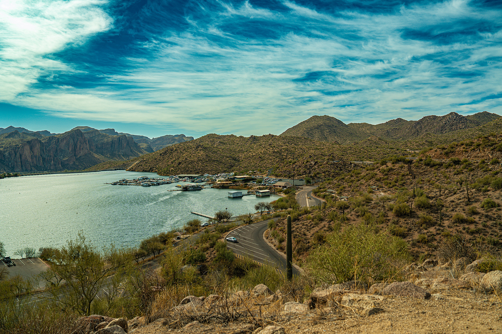 Bird’s eye view of Saguaro Lake with winding shoreline and desert terrain.