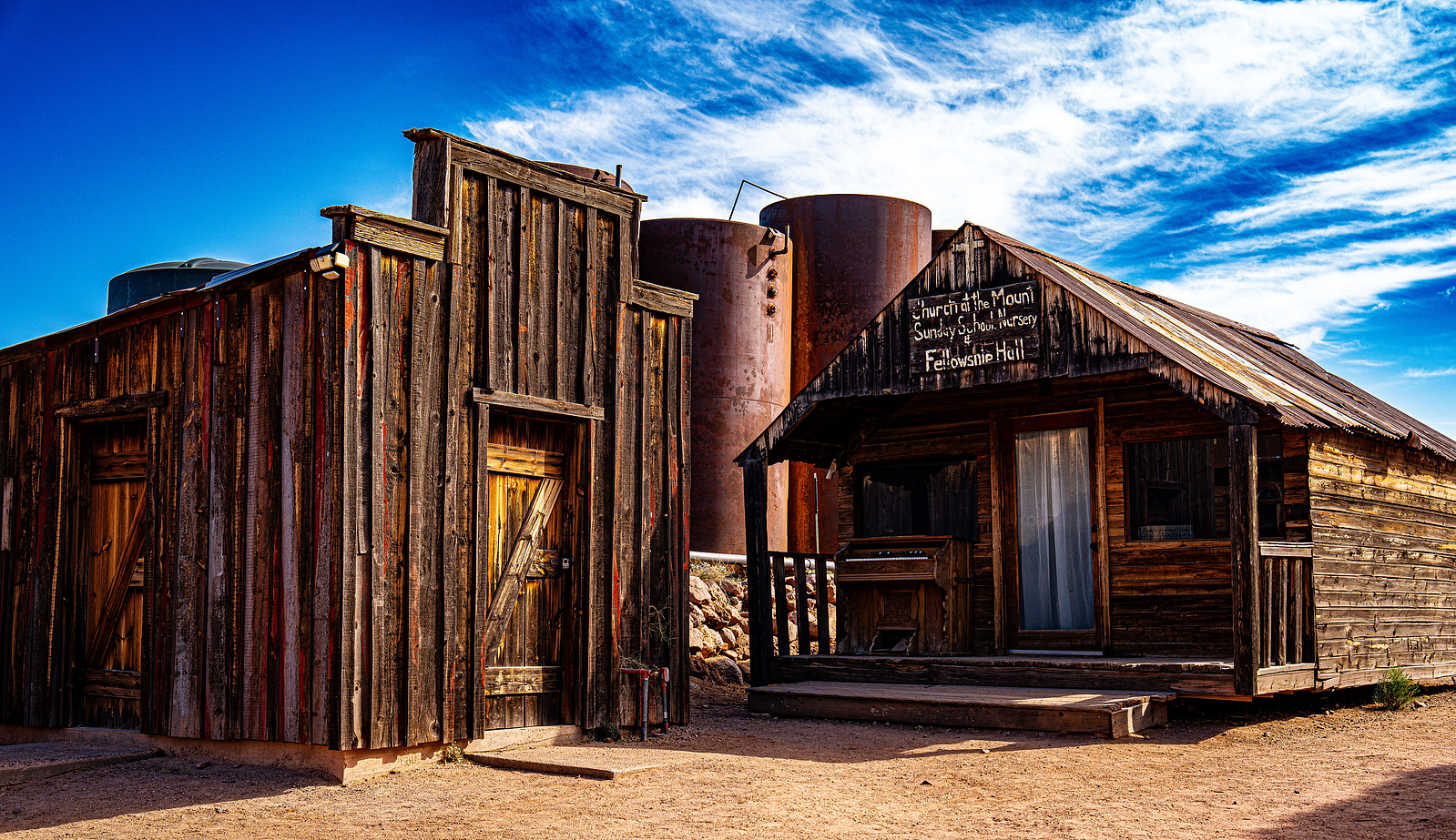Historic blacksmith and mining structures at Goldfield Ghost Town, a top destination for Arizona desert photography.