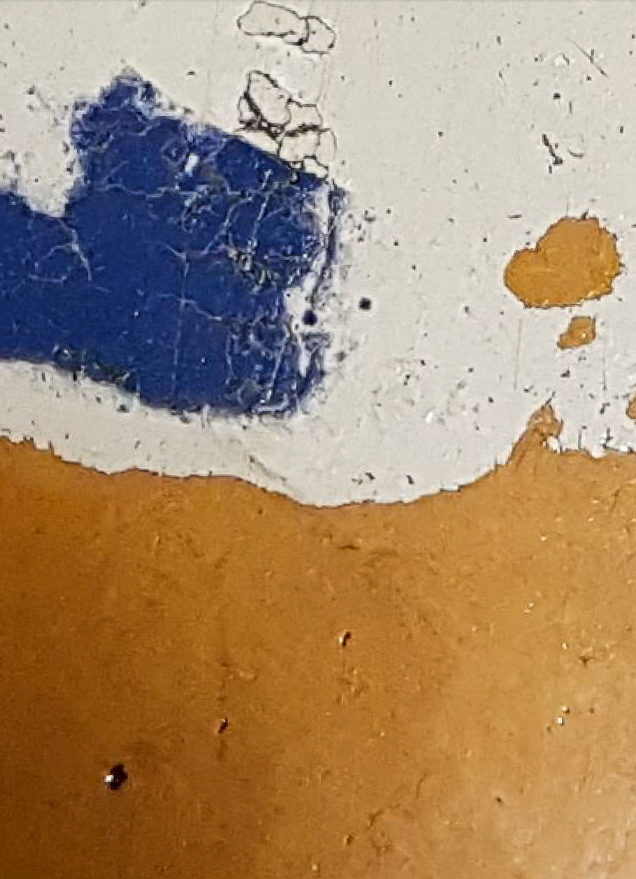 abstract - scuffed areas of white and yellow, in the top and bottom half of the image respectively, with a patch of blue on the white, as well as a tiny patch of yellow.