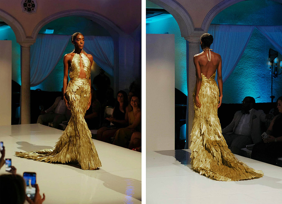 high fashion couture gold feather dress with wing top and mermaid skirt