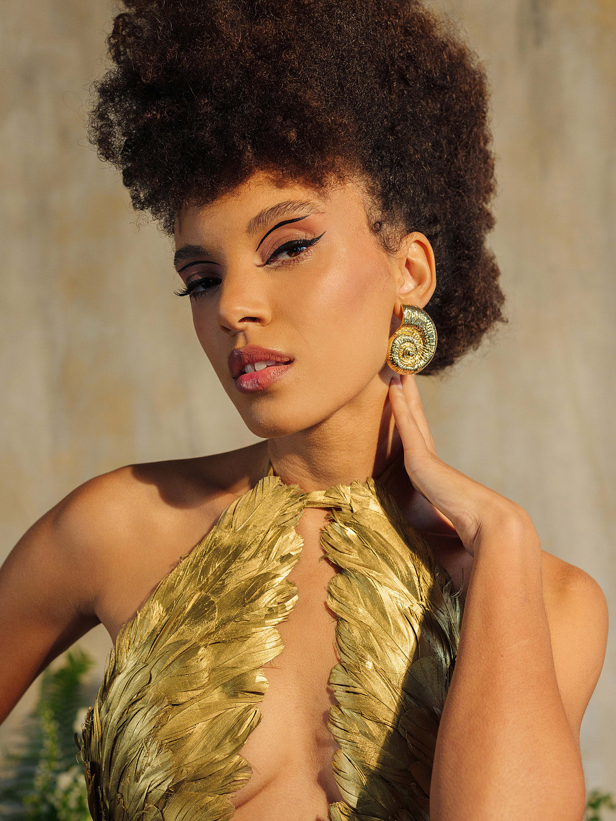 high fashion couture gold feather dress with wing top and mermaid skirt