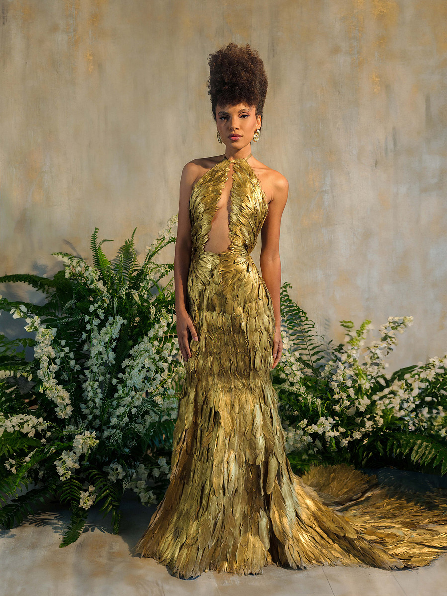 high fashion couture gold feather dress with wing top and mermaid skirt