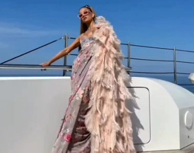 A pink ostrich feather cape won by a millionaire on a yacht on vacation in italy