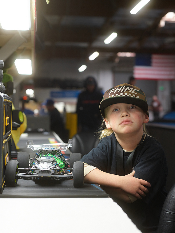 A driver poses for a portrait with his RC car inside Whip It RC Raceway & Hobbies in Reno, NV.