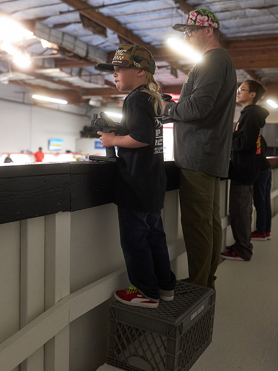 Drivers race their RC cars around the dirt track inside Whip It RC Raceway & Hobbies in Reno, NV.