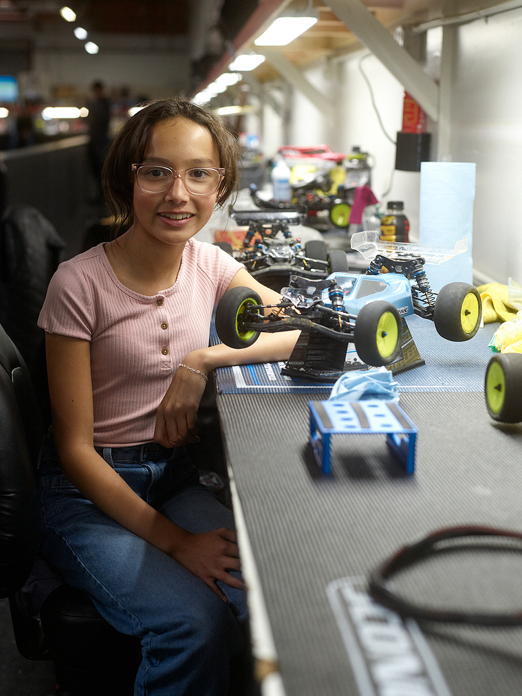 A young driver poses with her RC car in between races at Whip It RC Raceway & Hobbies in Reno, NV.