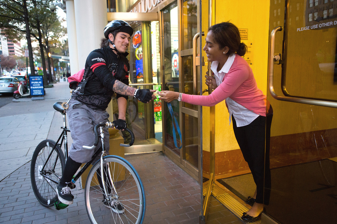 Bike messenger makes a delivery in Washington, DC.