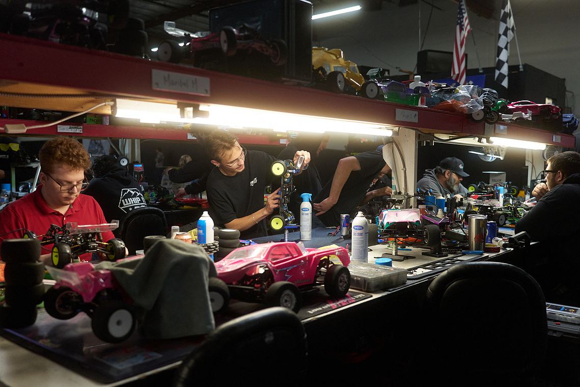 Drivers work on their RC cars in the pits at Whip It RC Raceway & Hobbies in Reno, NV.