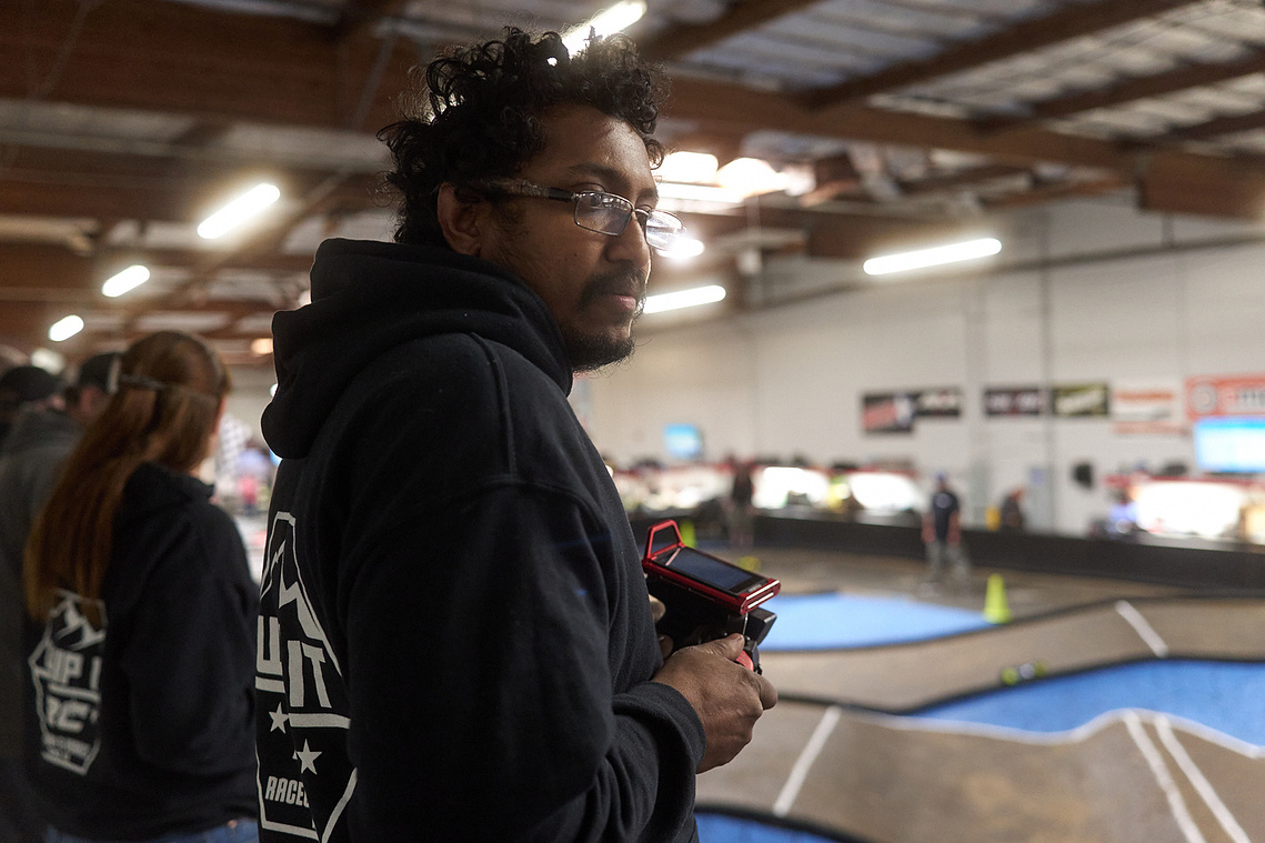 Drivers race their RC cars around the dirt track inside Whip It RC Raceway & Hobbies in Reno, NV.