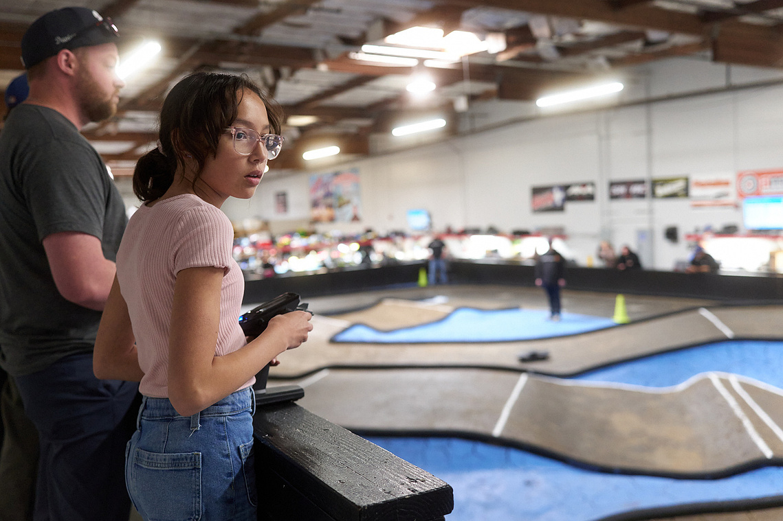 Drivers race their RC cars around the dirt track inside Whip It RC Raceway & Hobbies in Reno, NV.
