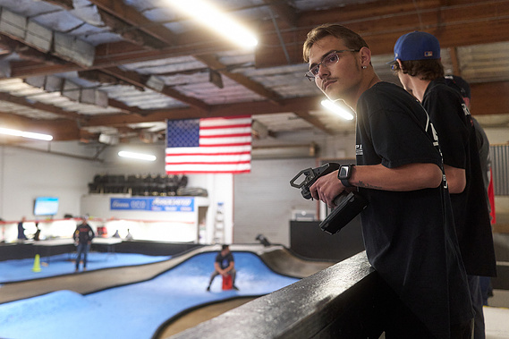 Drivers racing their RC cars around the dirt track inside Whip It RC Raceway & Hobbies in Reno, NV.