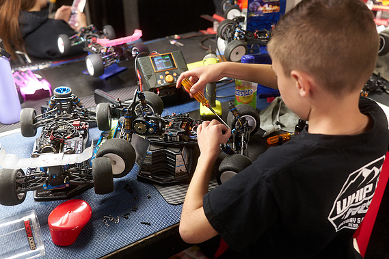A young driver works on his RC car at his pit station in between races at Whip It RC Raceway & Hobbies in Reno, NV.