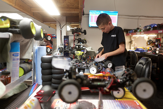 A young driver works on his RC car at his pit station in between races at Whip It RC Raceway & Hobbies in Reno, NV.