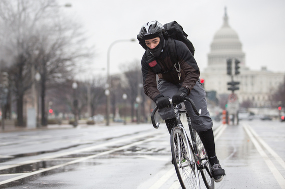 Bike messenger riding on Pennsylvania Ave in Washington, DC.
