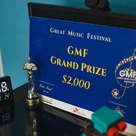 A blue sign reads "Great Music Festival Grand Prize $2000"