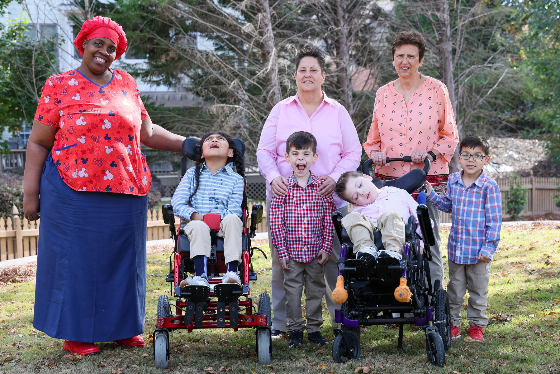 The Lyon Black family poses with their nurse Nikkie. 