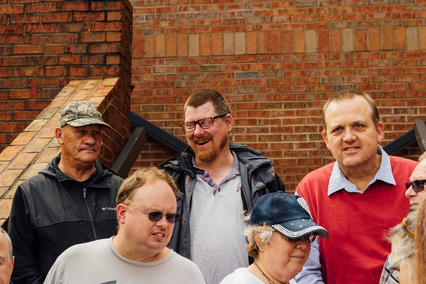 Group from the Dream Weavers stands on a brick staircase. 