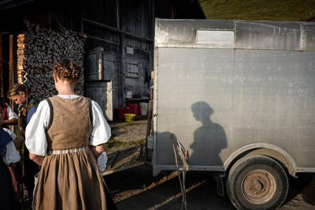 Celebrating the &quot;Alpabzug&quot; in the mountains above Meiringen in Canton Bern, the Anderegg family in full traditional costume get ready to bring down the cows from the summer pastures. 