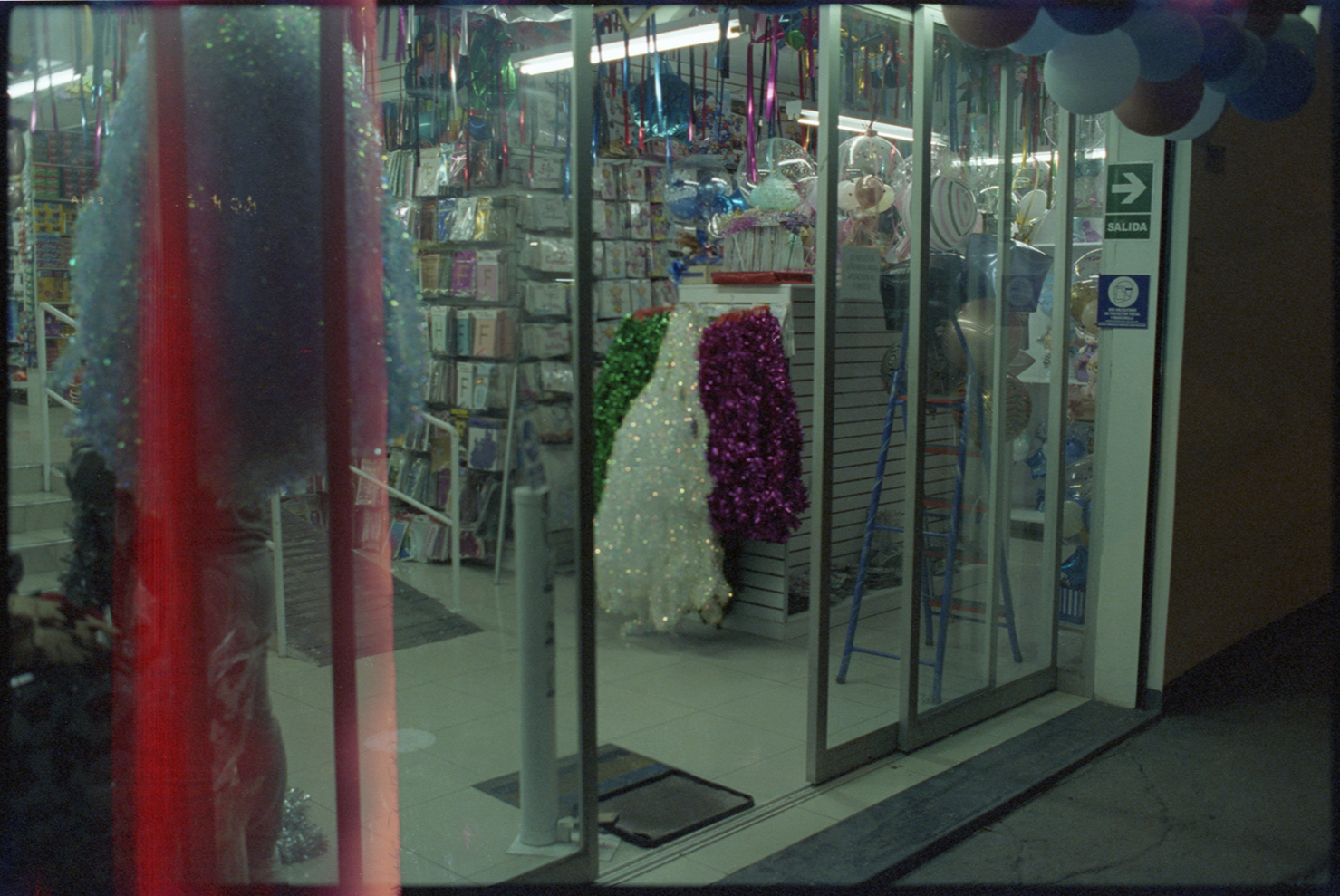Glass entrance door of a store selling party supplies