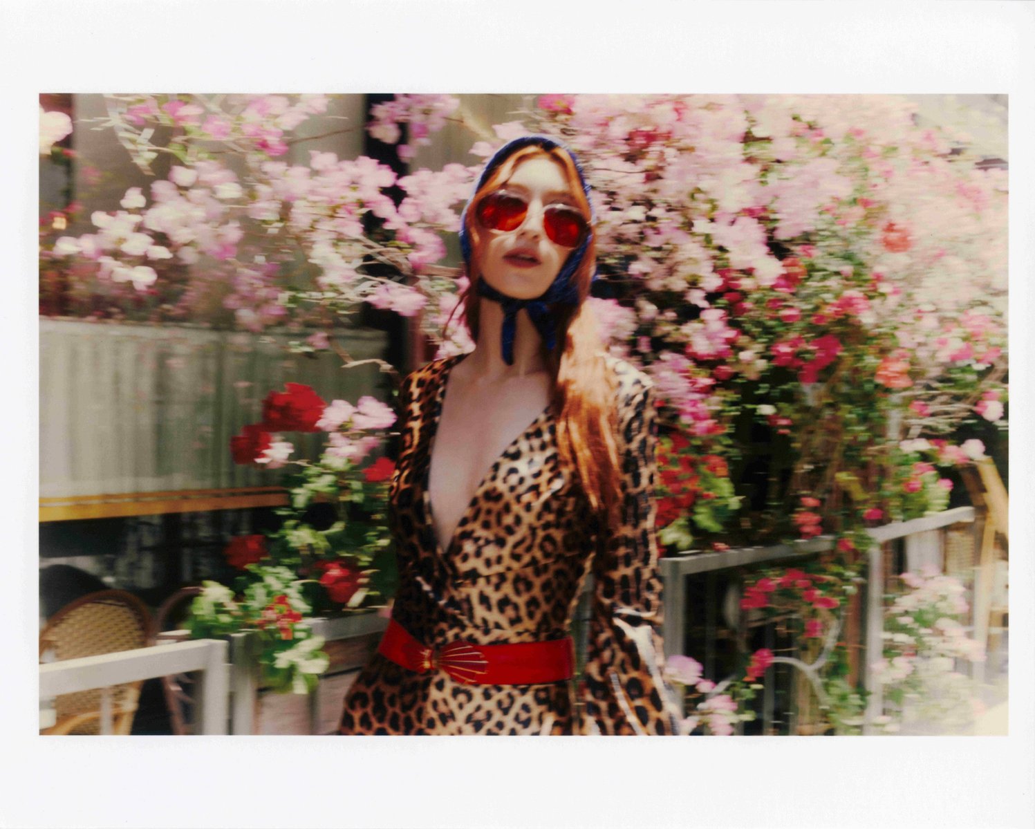 Editorial fashion portrait of model Clementine Callaway in cheetah print outfit and red sunglasses for Quirk campaign in Downtown LA