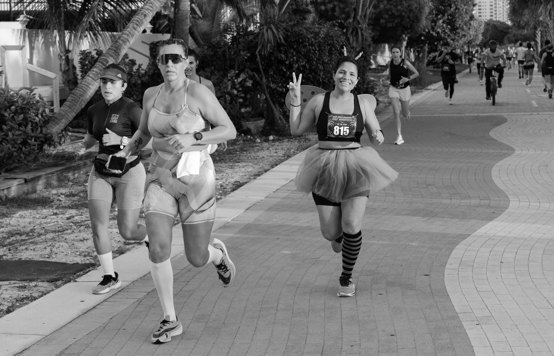 Women running in Halloween costumes.