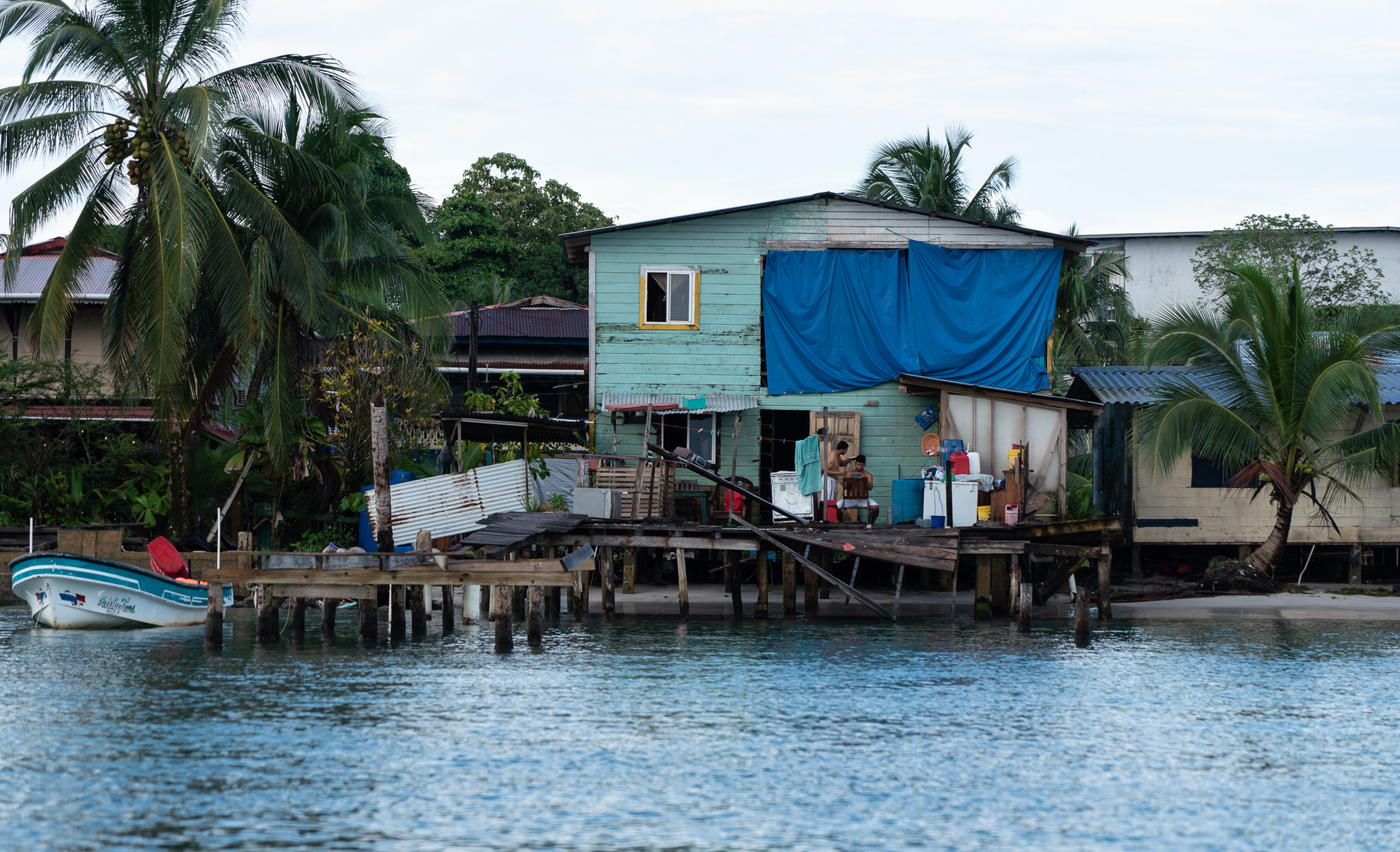 Caribbean Homes with pam trees and blue sky on the water