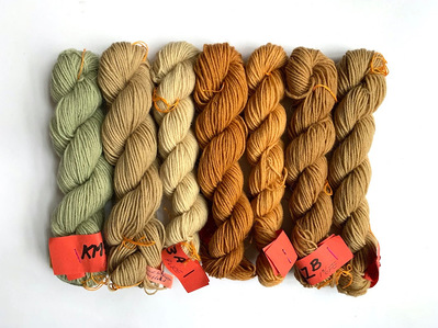 Seven skeins of wool dyed with wood, bark and lichen.