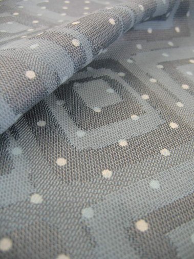 a jacquard woven fabric made from cotton and polyester with a combination of a jacquard-woven design with a printed design on top, by Joost Post