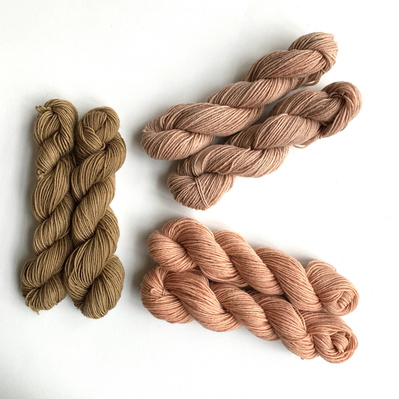 Three skeins of wool dyed with three different types of wood (pruning waste).