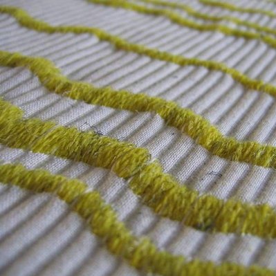 jacquard woven double fabric in white cotton with a yellow woolen filling yarn by Joost Post