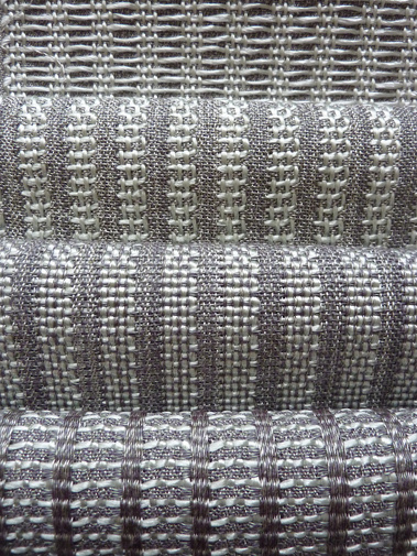 set of four handwoven fabrics made from silver grey polyester and shiny mint green polypropylene by Joost Post