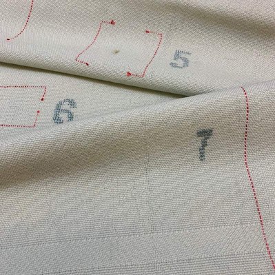 A 100% woolen weave showing the seven most common weaving mistakes. A combination of weaving and embroidery. By Joost Post