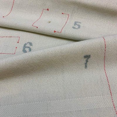 A 100% woolen weave showing the seven most common weaving mistakes. A combination of weaving and embroidery. By Joost Post